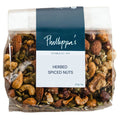 Packaged herbed spiced nuts with a label on a white background