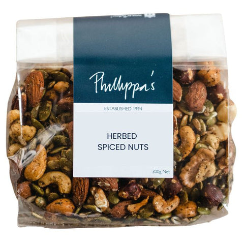 Packaged herbed spiced nuts with a label on a white background